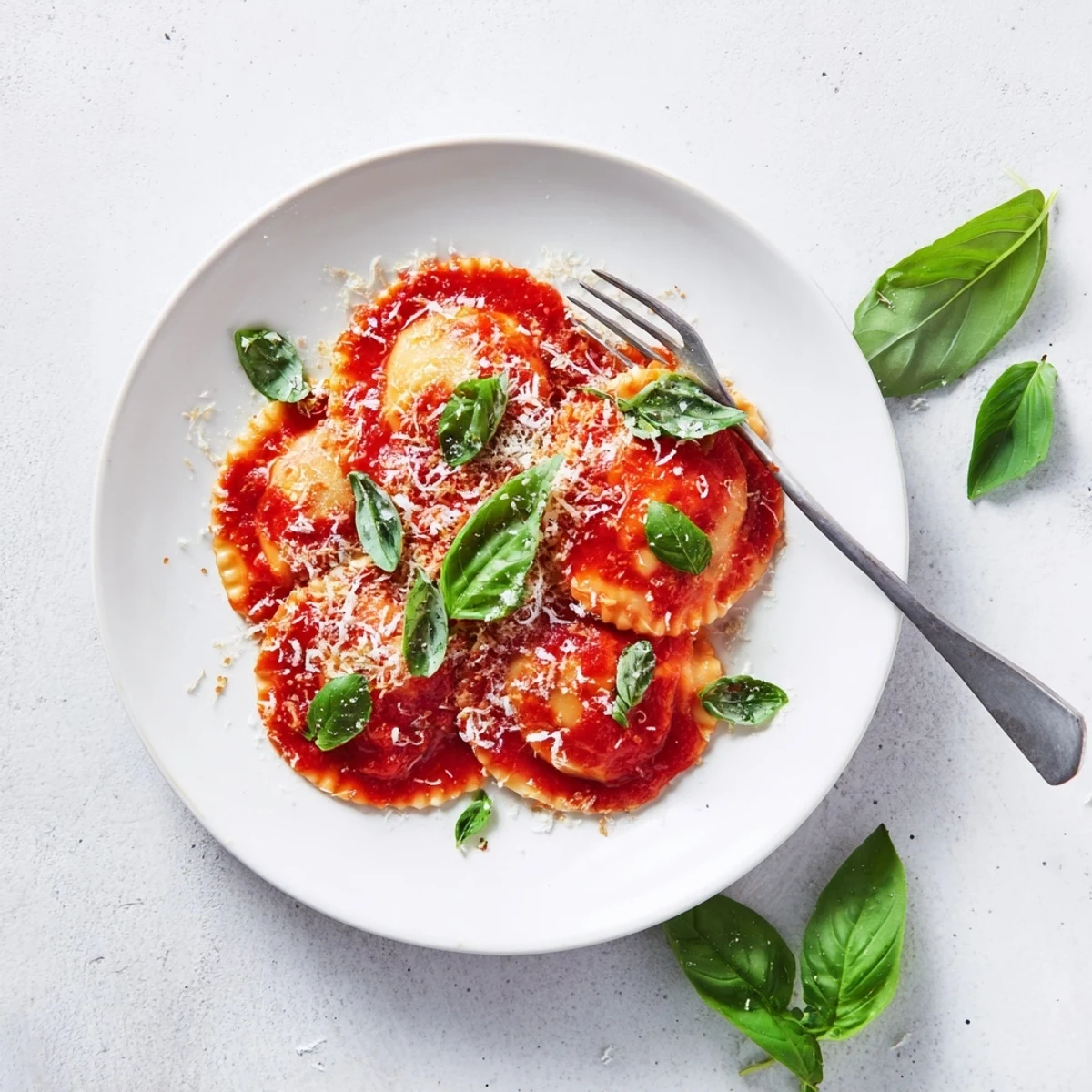 Cheese 20-Minute Ravioli with Simple Sauce is twirled on a fork, paired with crusty bread and salad.