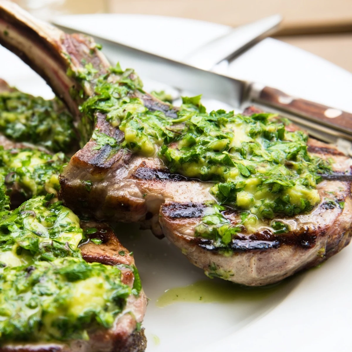 Tender lamb chops fresh off the grill topped with creamy herb dressing.