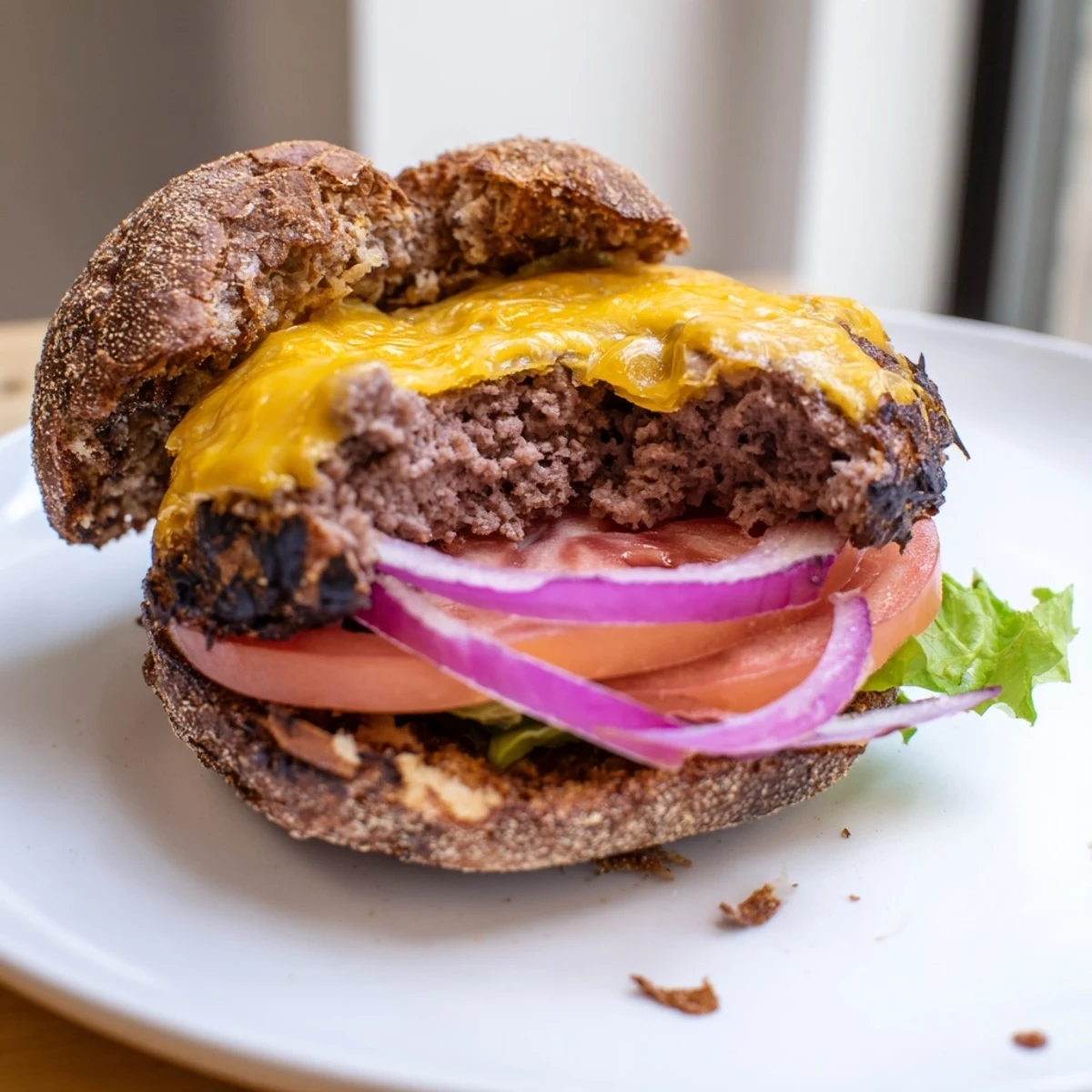 Golden brown smash burger patty topped with melting cheddar served on buttered bun