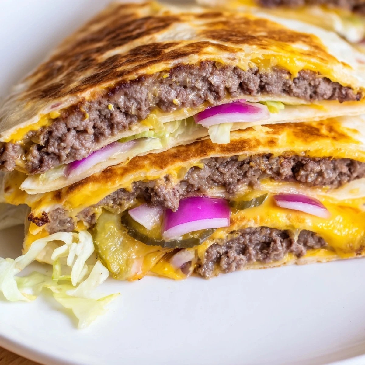 Crispy flour tortilla folded over seasoned smashburger with mozzarella, pickles, and drizzled condiments