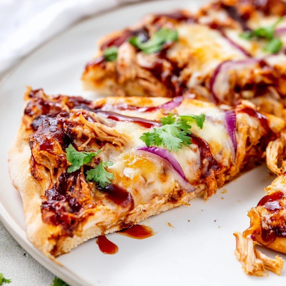 Delicious homemade BBQ chicken pizza with colorful bell peppers and smoky Gouda cheese baked golden brown