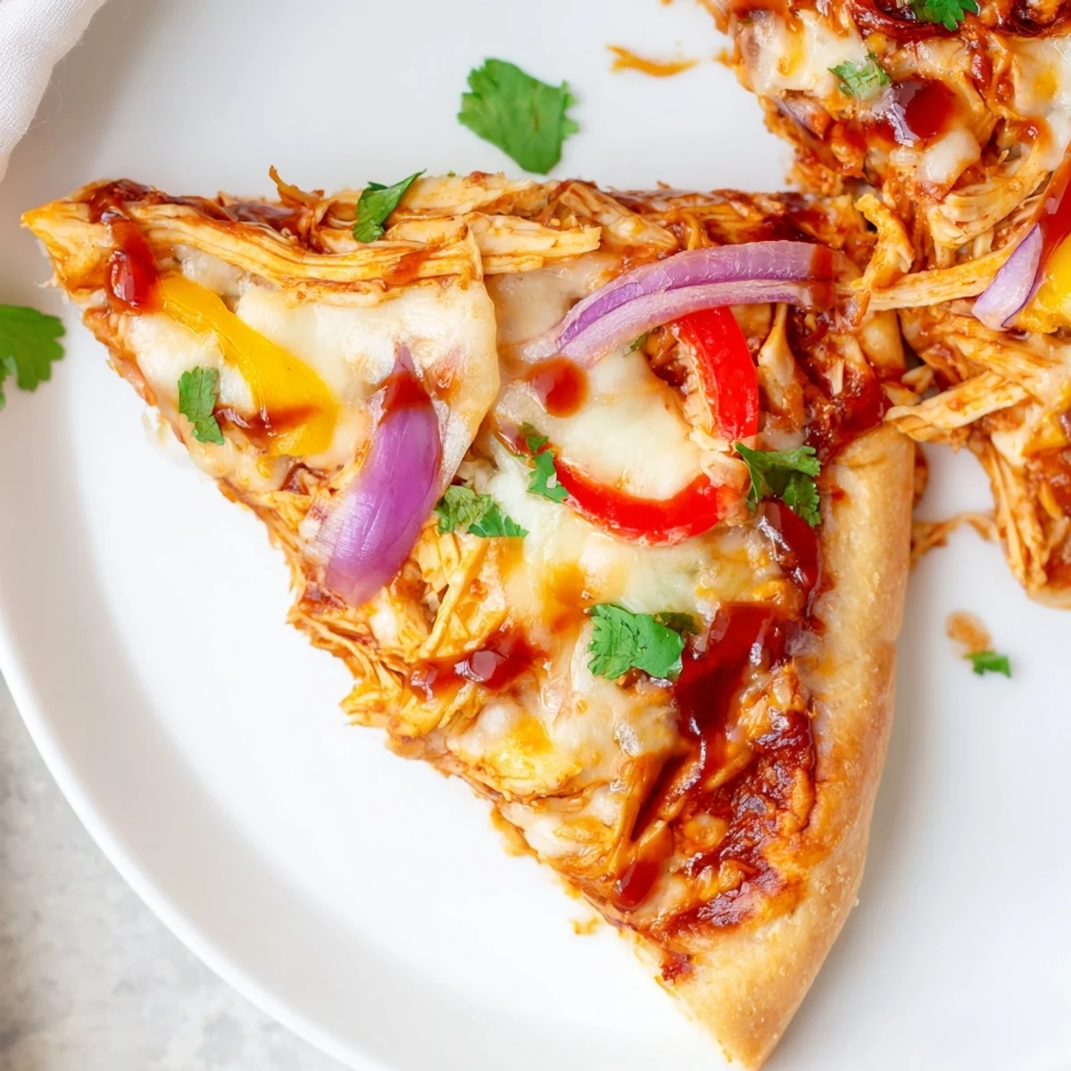 Savory BBQ chicken pizza featuring smoky sauce, tender chicken, and bubbling cheese on a crispy crust