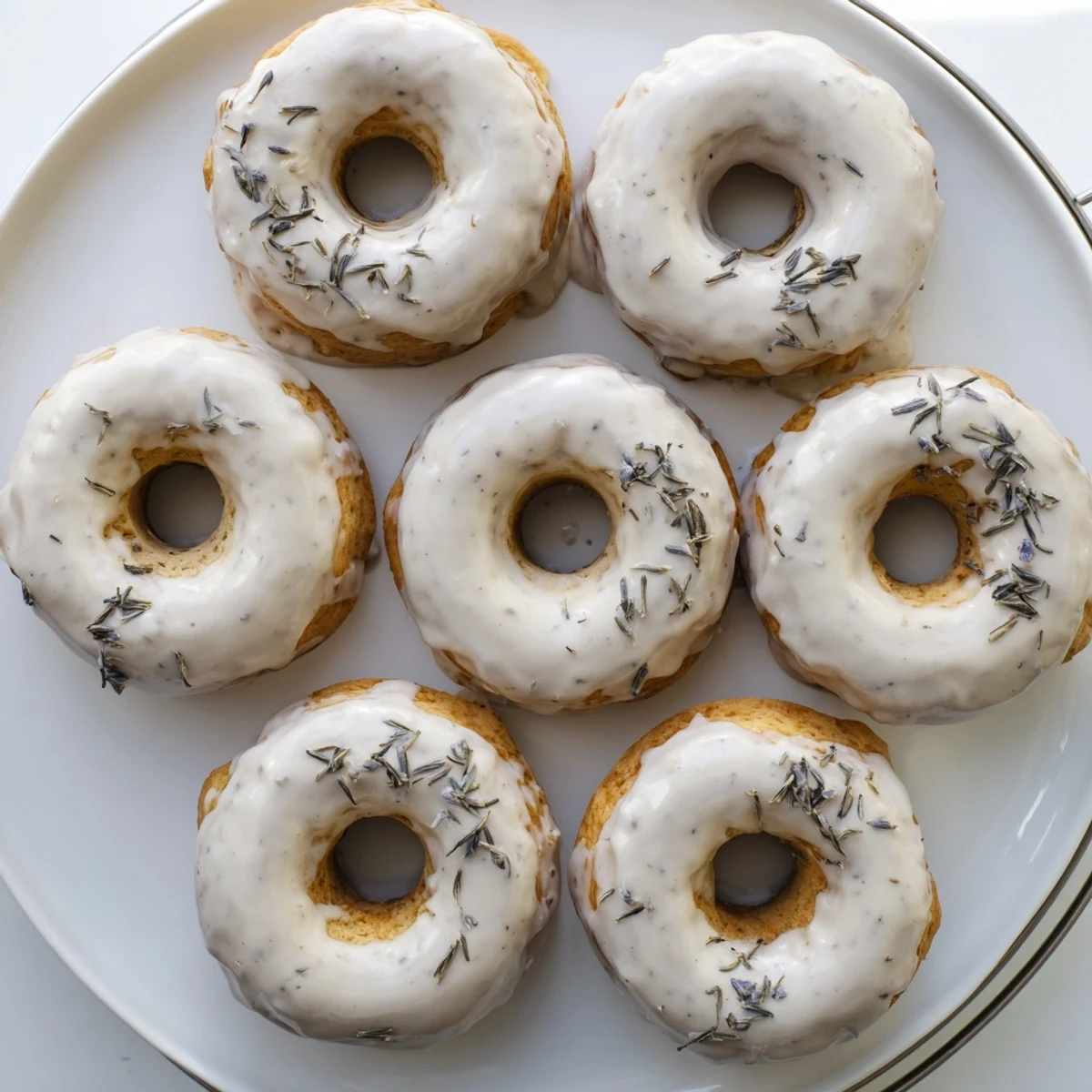 Chewy tea-infused donuts topped with vanilla icing and speckled Earl Grey tea leaves