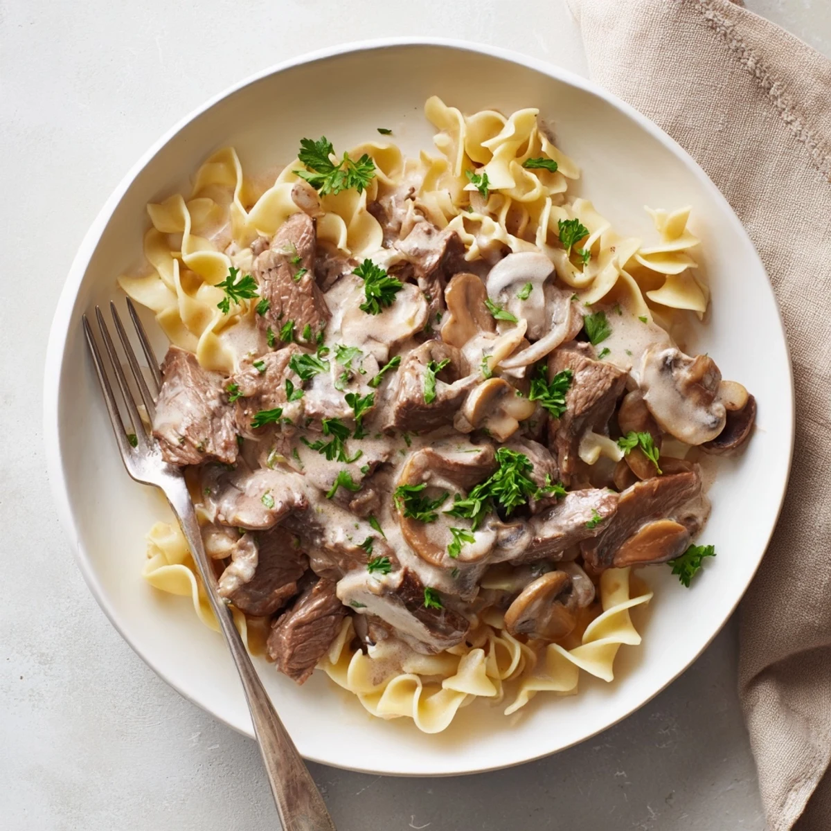 Golden mushroom sauce coats juicy beef in this classic beef stroganoff main dish