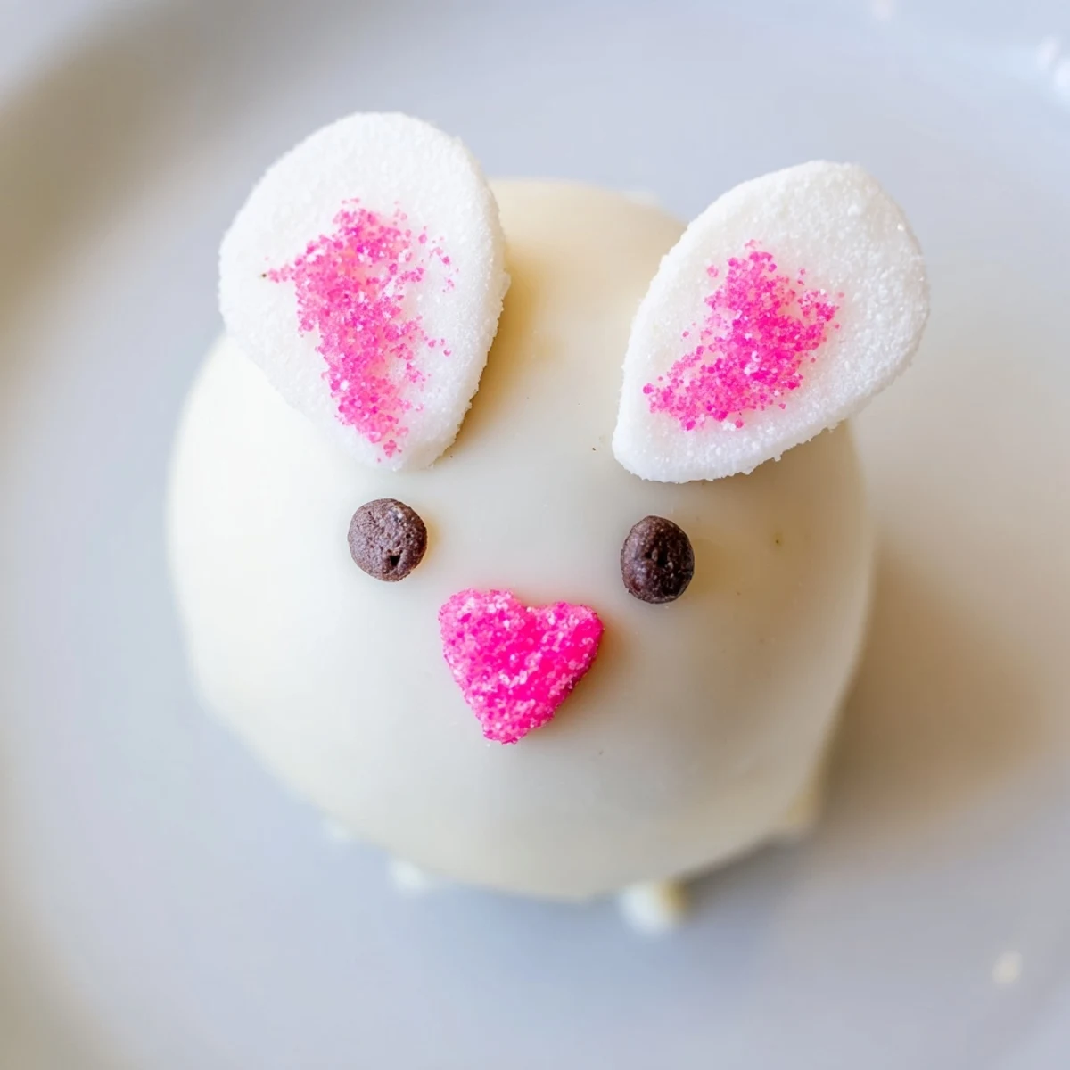 Adorable no-bake Bunny Oreo balls featuring creamy white chocolate coating with playful marshmallow ears, heart sprinkles, and mini chocolate chip eyes