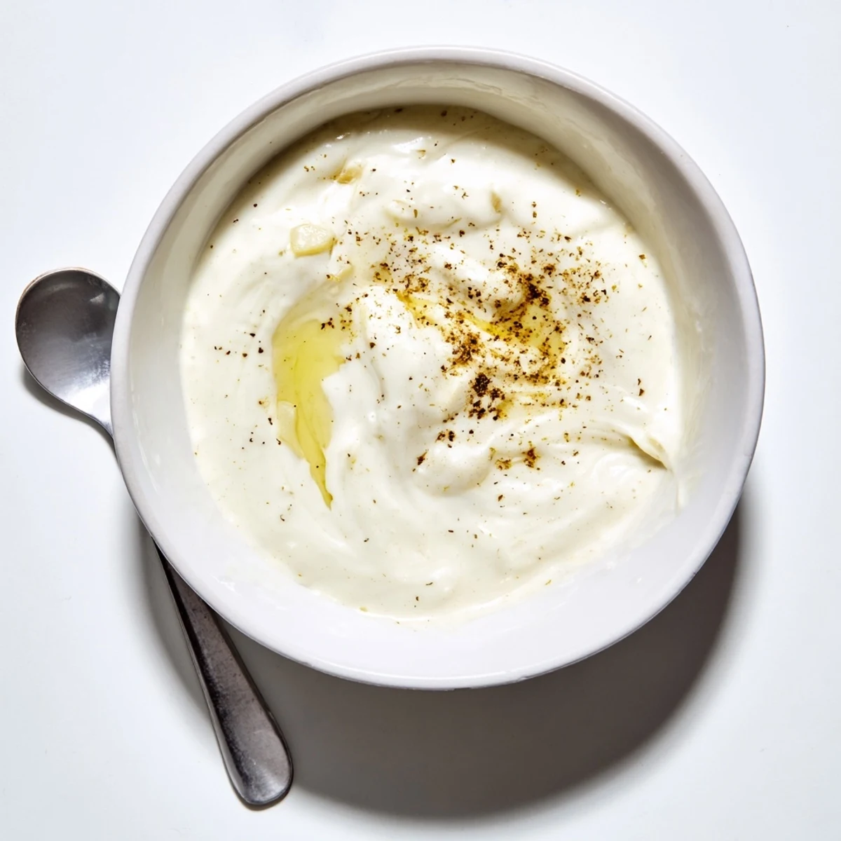 Smooth tangy white sauce prepared with mayonnaise and yogurt, perfect for serving alongside Middle Eastern chicken shawarma wraps