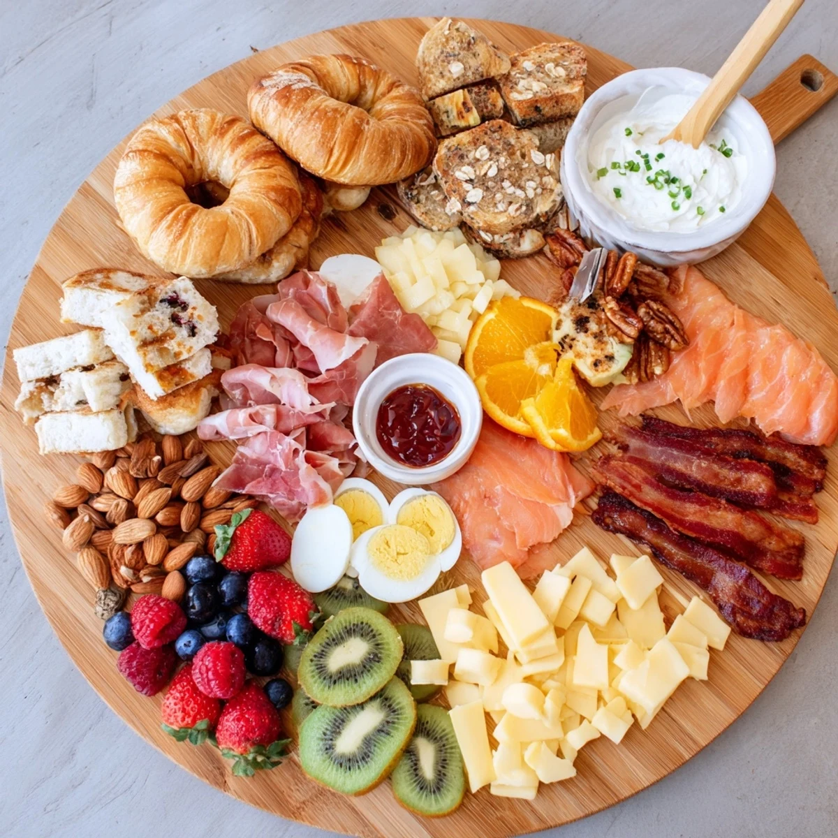 Crowd-pleasing breakfast charcuterie board featuring smoked salmon, bagels, honey, and colorful fresh fruits for sharing
