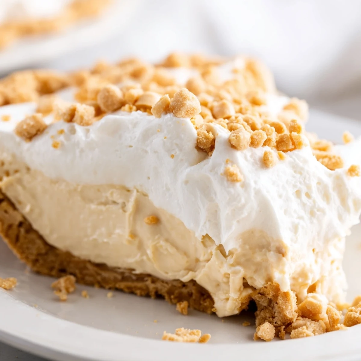 Velvety Amish Peanut Butter Dream Pie slice showing luscious peanut butter filling