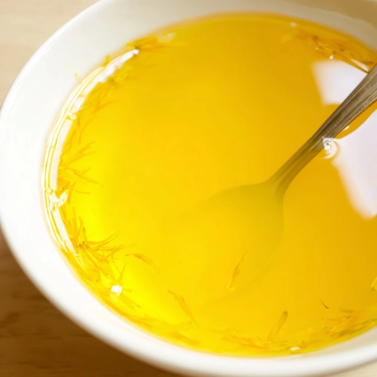 Golden homemade fresh dandelion jelly spread on warm toasted bread