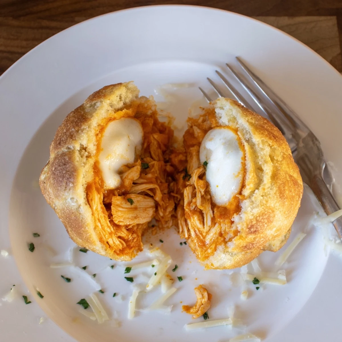 Buffalo Chicken Mozzarella Bombs steaming golden, oozing melted cheese, perfect for game day