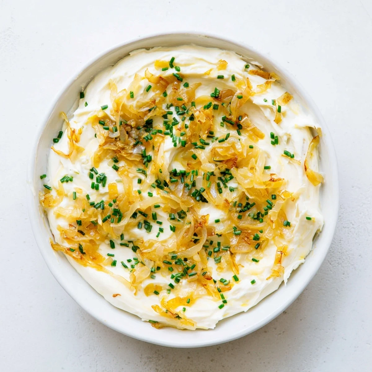 Golden brown caramelized onions folded into smooth French onion dip presented with vegetable crudités assortment