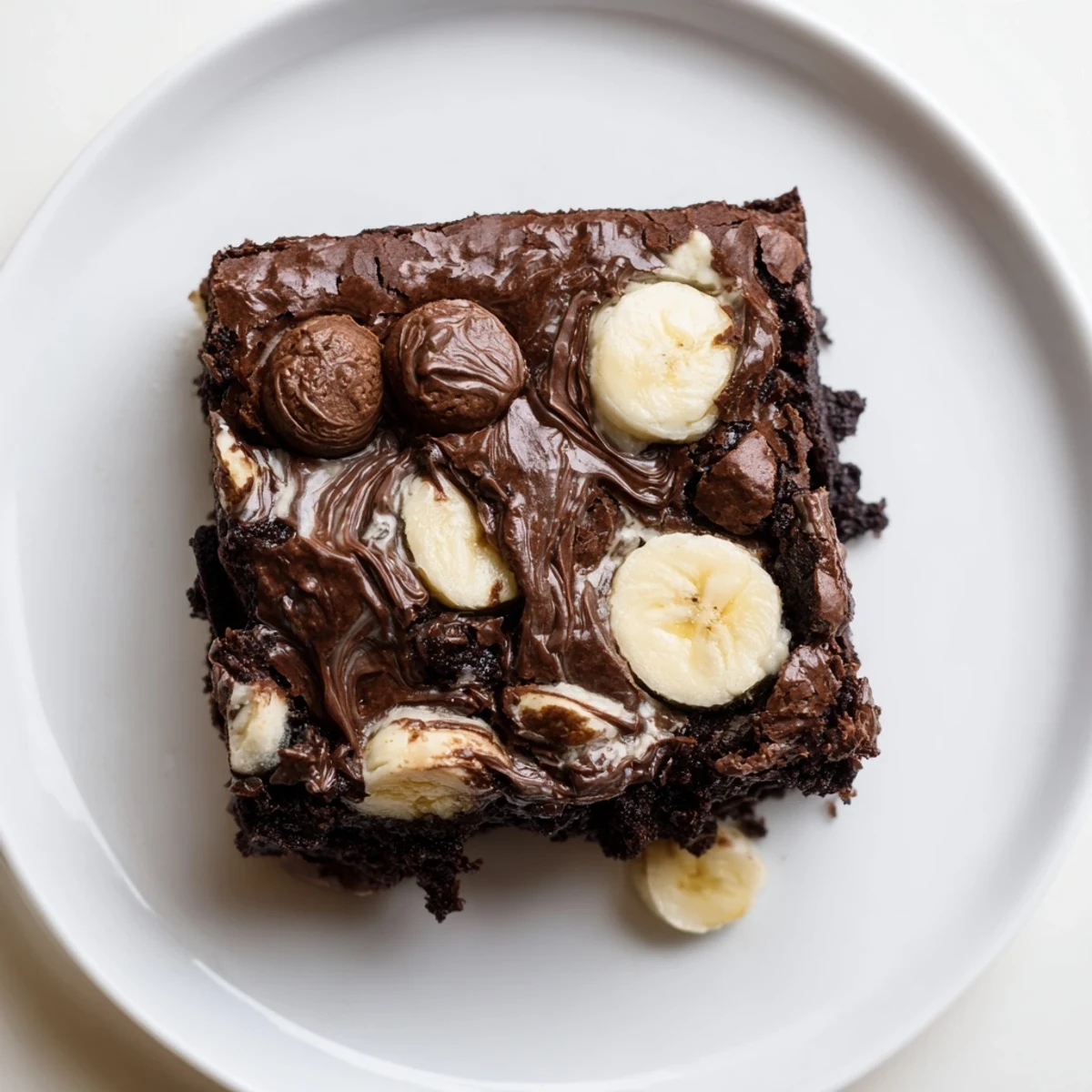 Warm Banana Pudding Brownies with marbled banana swirls and crunchy vanilla wafers