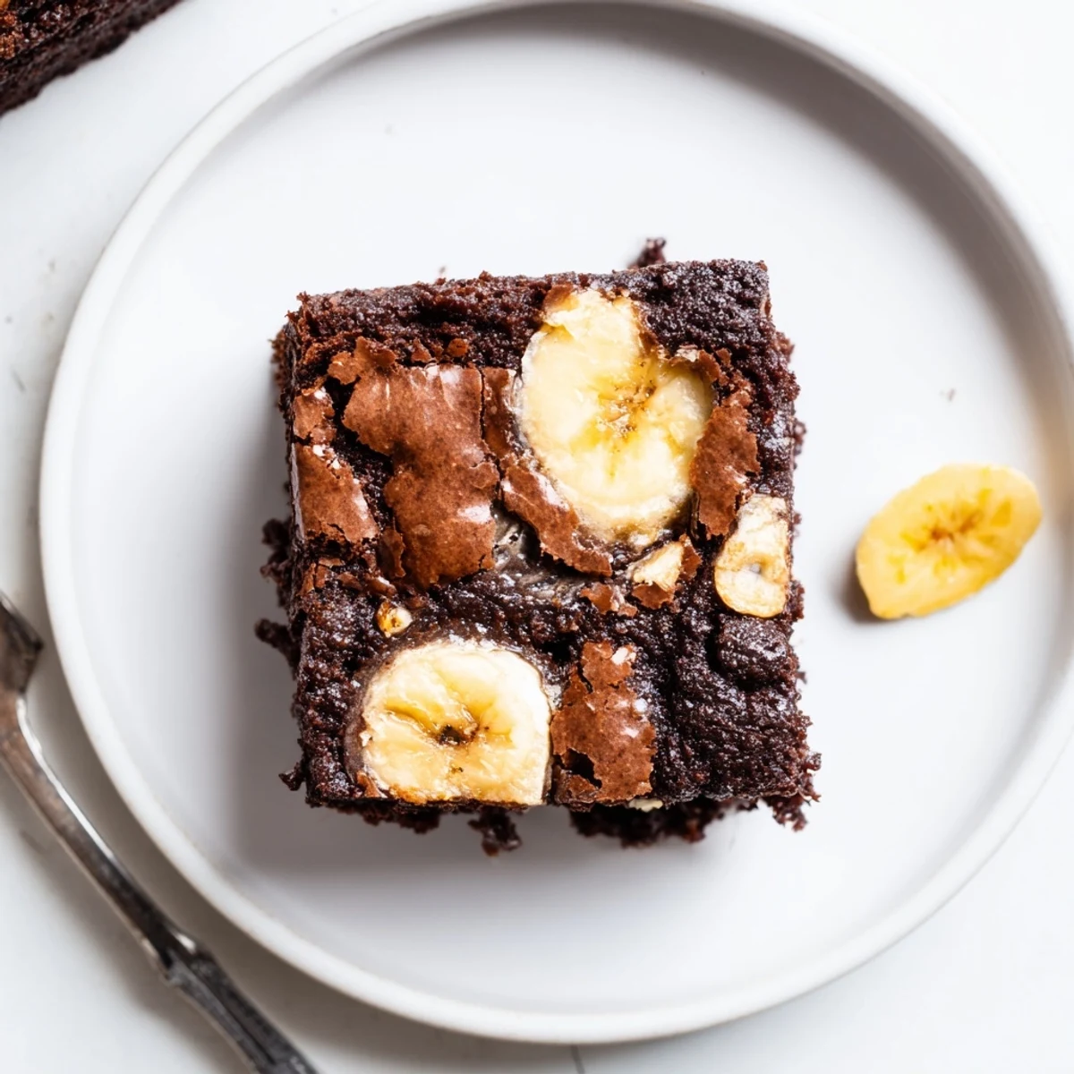 Fudgy Banana Pudding Brownies studded with vanilla wafer pieces, served with ice cream