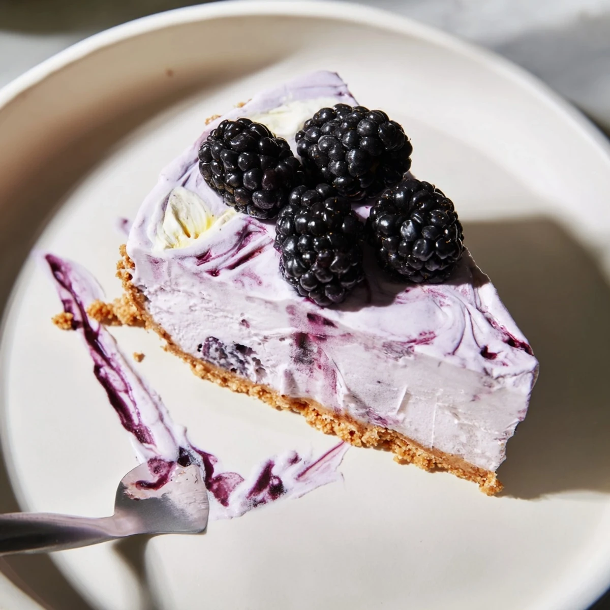 Silky purple blackberry lavender cheesecake filling piped into a buttery graham cracker crust